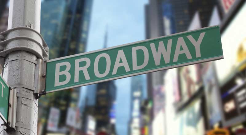 A close-up of a Broadway street sign