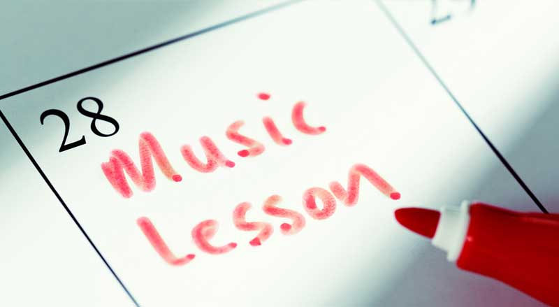Calendar marked with “Music Lesson,” representing scheduled practice goals and commitment to music learning